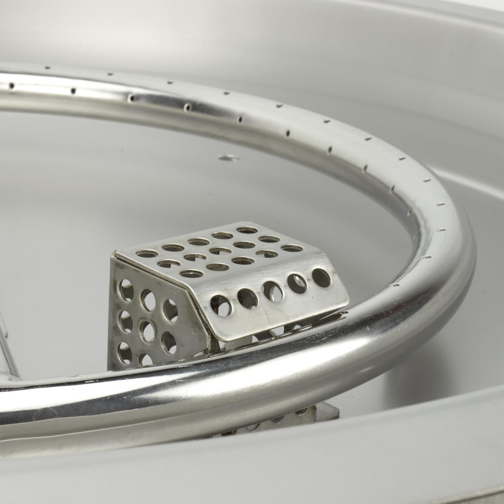 The thermocouple and spark igniter protect by the burner kit's cage.