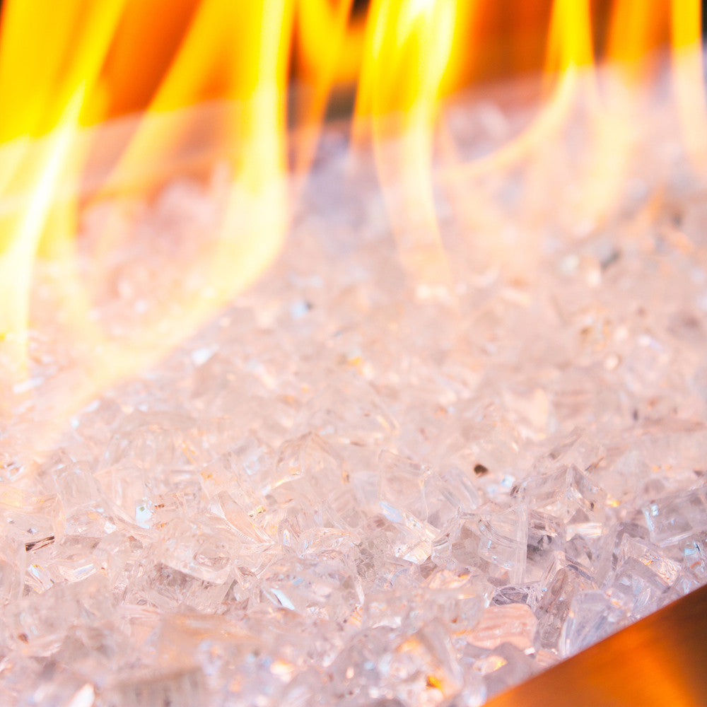 Close up of zircon-like tempered fire glass in a smoldering fire pit