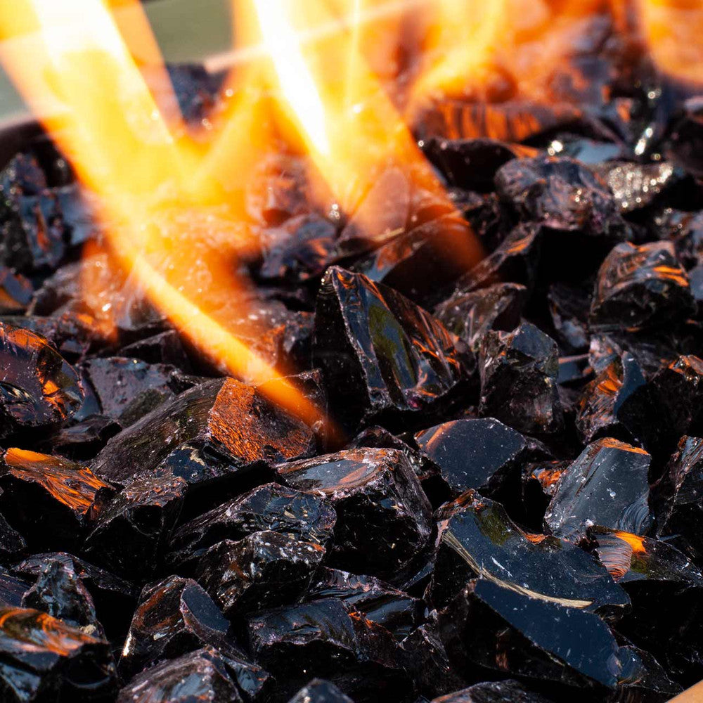 Close up of jet-black crushed fire glass rocks