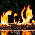 Horizontal view of jet black crushed fire glass in a gas fire pit
